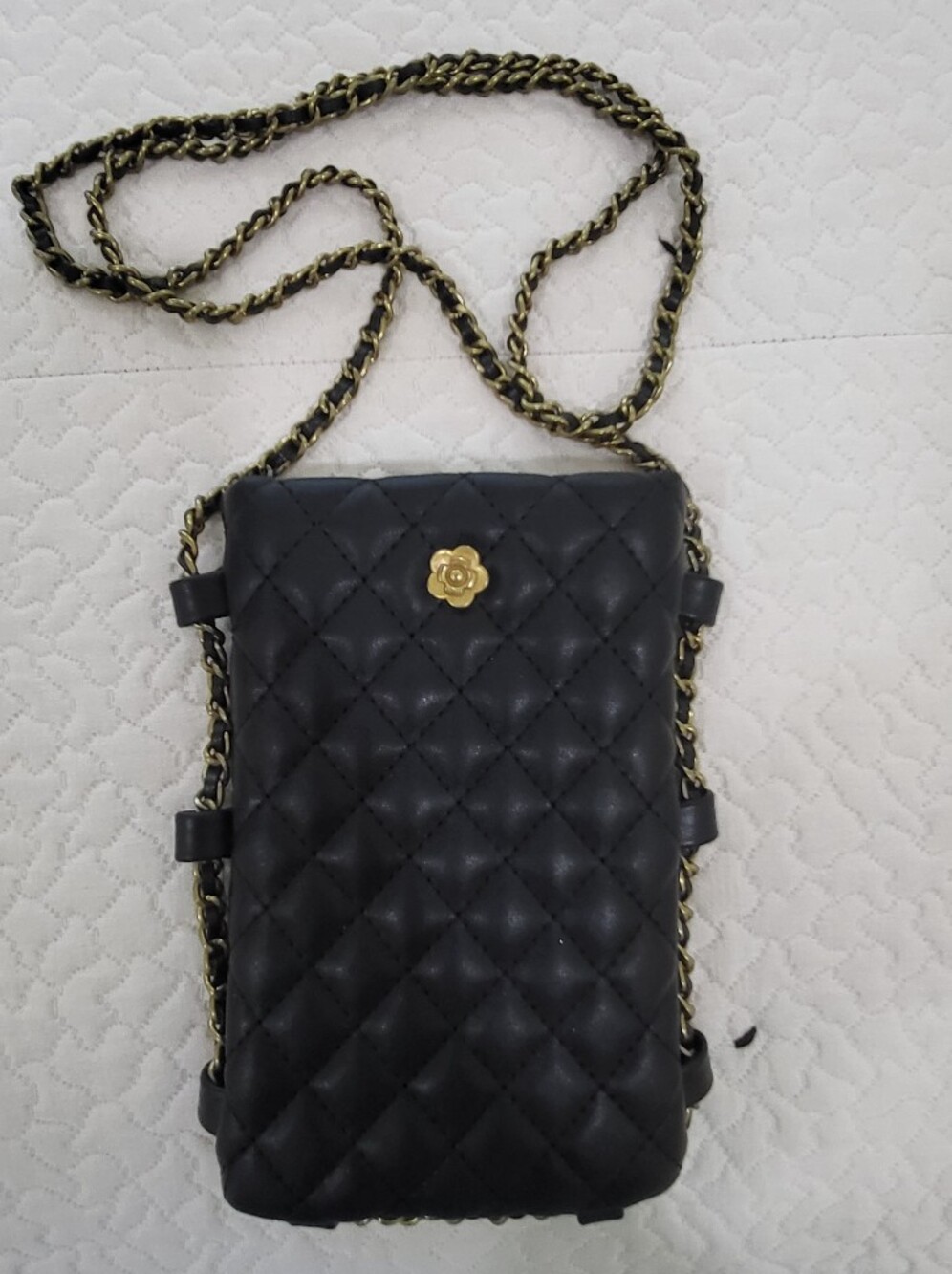 Black Quilted Crossbody Bag with Gold Flower Accent
